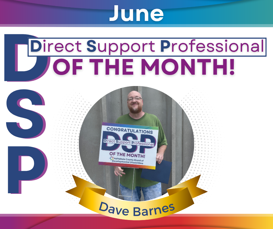 Pictured one man (David Barnes)  standing with a DSP of the Month sign in the front of a building. 