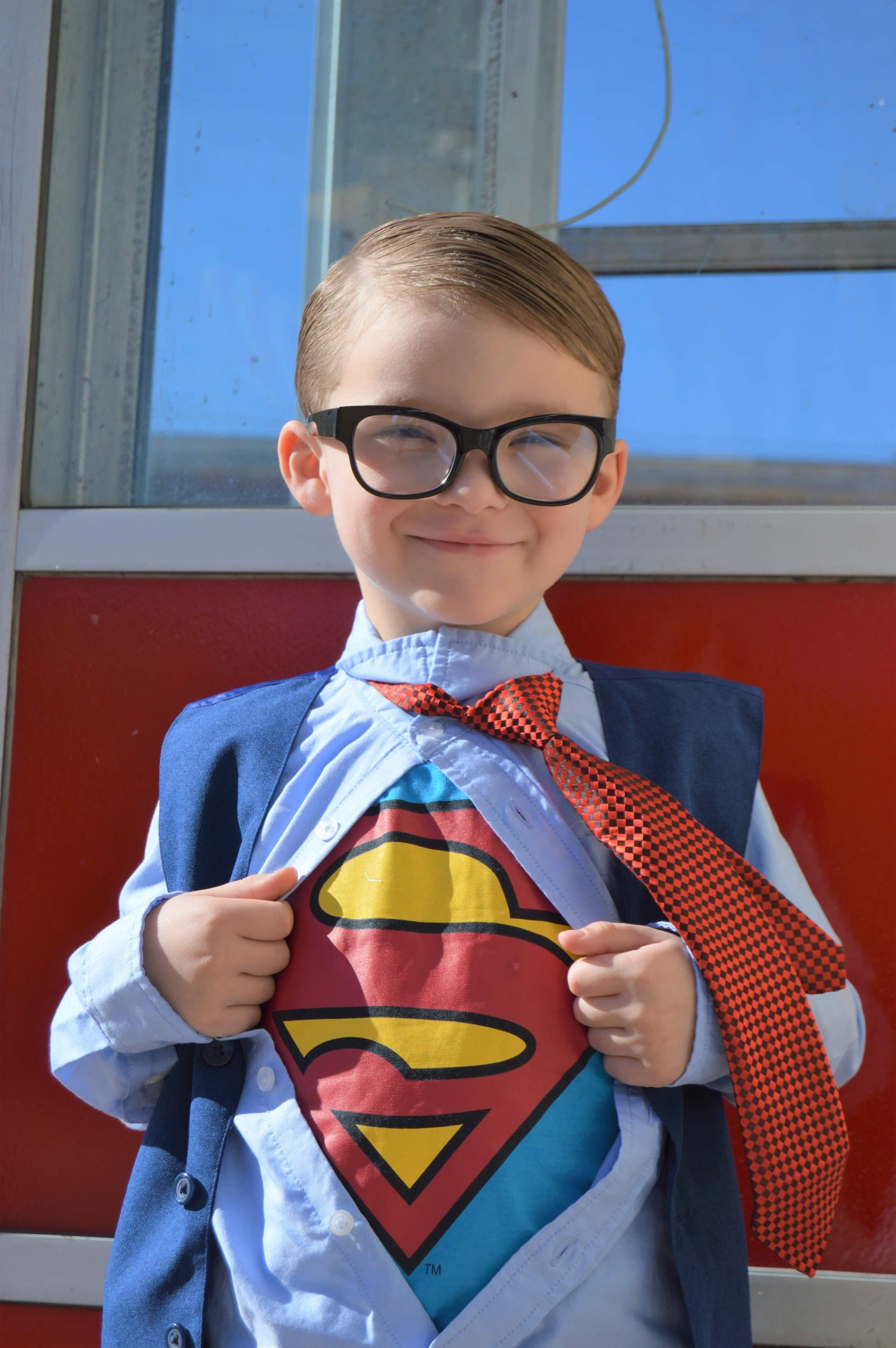 Boy wearing superman costume