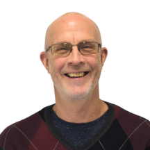 man with glasses smiling