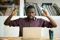 Man confused at computer
