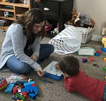 Mother and young son reading a book