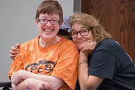 Mother and daughter smiling