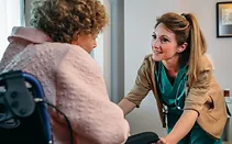 Nurse helping elder patient